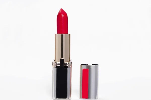 Lipstik merah pada latar belakang lampu — Stok Foto