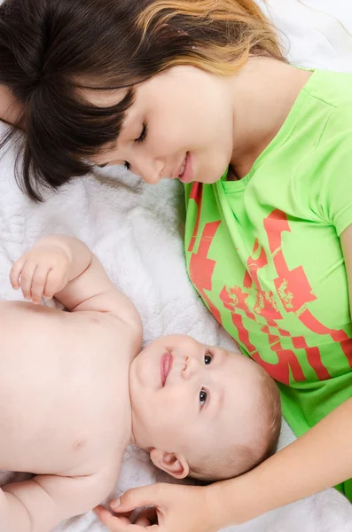 Young mother puts her baby to sleep — Stock Photo, Image