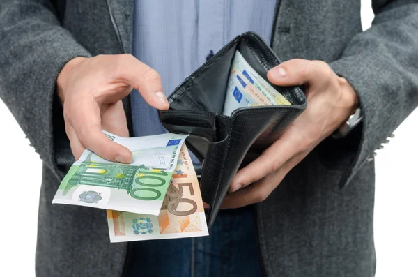 Euron och plånbok i händerna på männen — Stockfoto