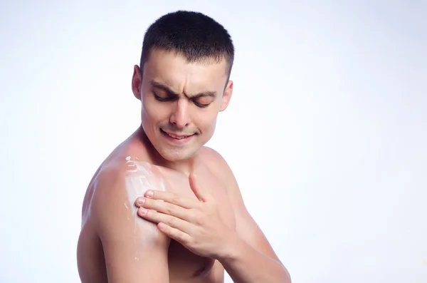 Young man burnt plaster sun skin cream — Stock Photo, Image