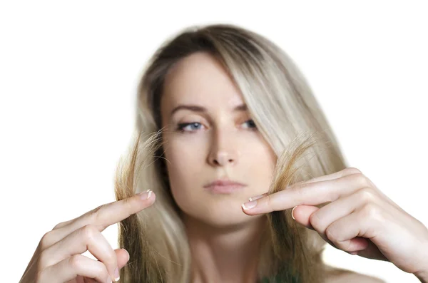 Woman holding ends of her hair — Stock Photo, Image