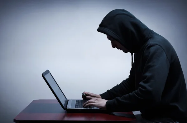 Hacker stealing data from computer — Stock Photo, Image