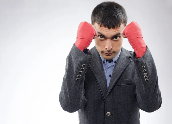 Businessman in boxing bandages ready for battle — Stock Photo, Image