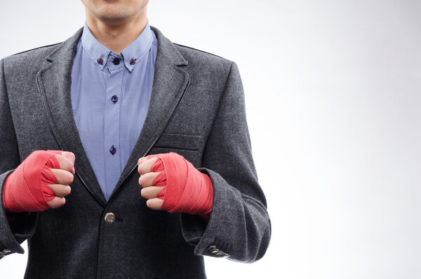 businessman in boxing bandages ready for battle