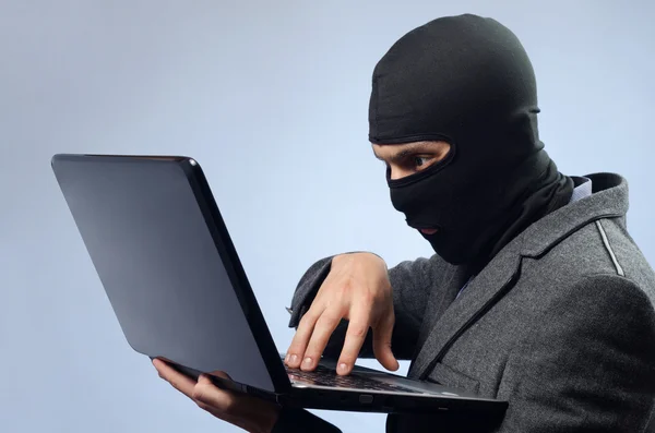 Stealing data from a laptop — Stock Photo, Image