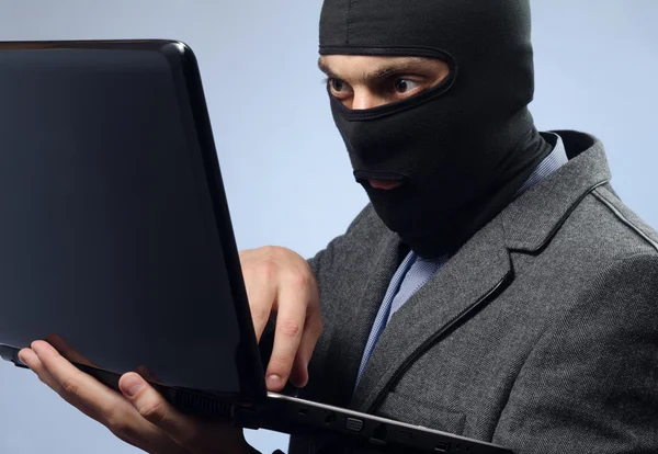 Stealing data from a laptop — Stock Photo, Image