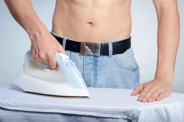 Man ironing a shirt — Stock Photo, Image