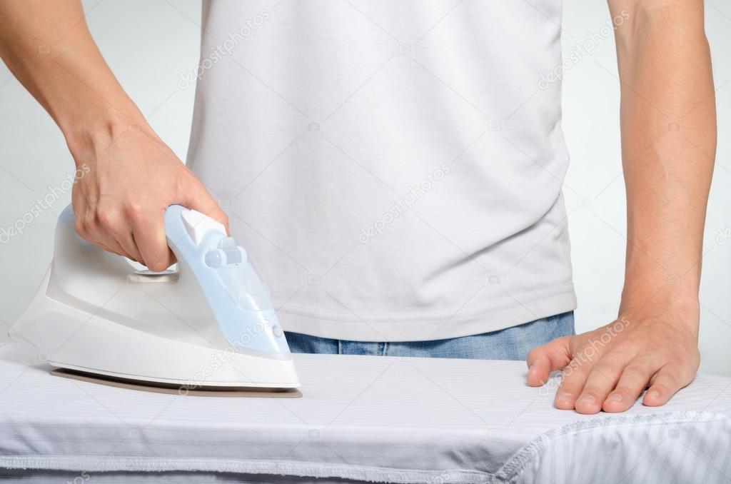 man ironing a shirt