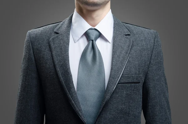 gentleman in a gray suit and tie