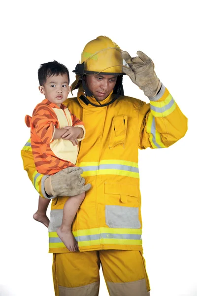 Firefighter, fireman save children from fire — Stock Photo, Image
