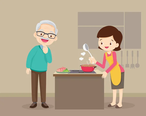 happy family with Grandparent and mother cooking in kitchen,Elderly man looking at woman cooking