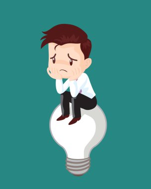 Fikir ampul üzerinde oturan işadamı