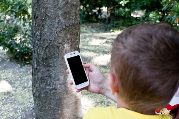 Mother and son watching phone.