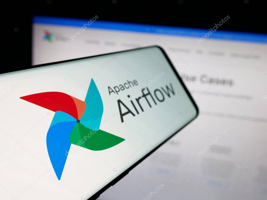 Stuttgart, Germany - 10-08-2025: Smartphone with logo of workflow management platform Apache Airflow on screen in front of website. Focus on left of phone display.