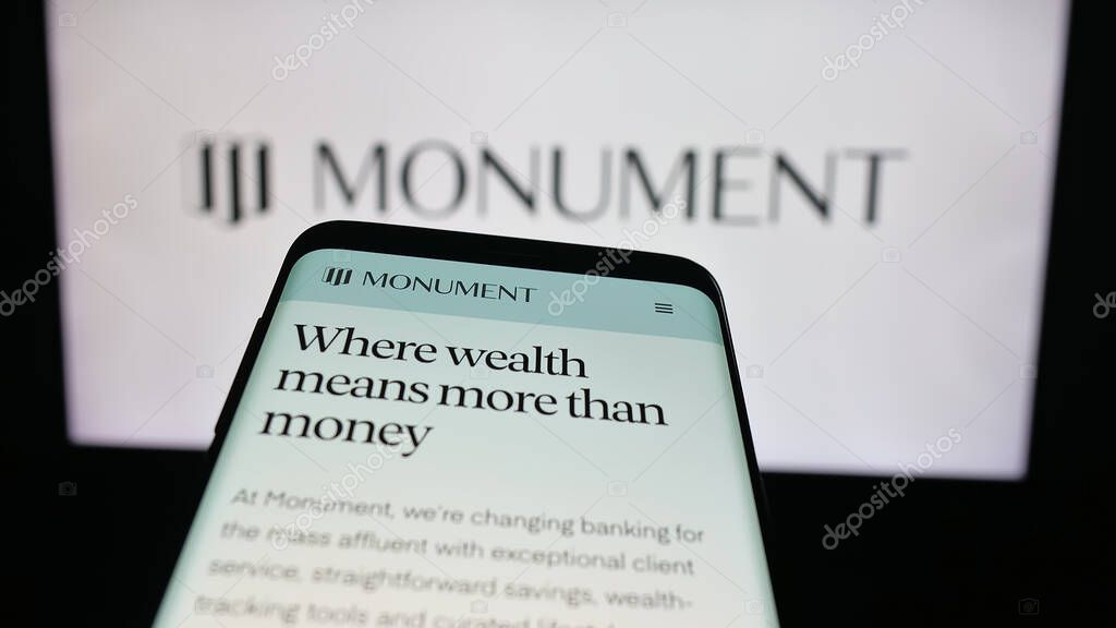 Stuttgart, Germany - 10-08-2025: Mobile phone with website of British banking company Monument Bank Limited on screen in front of logo. Focus on top-left of phone display.