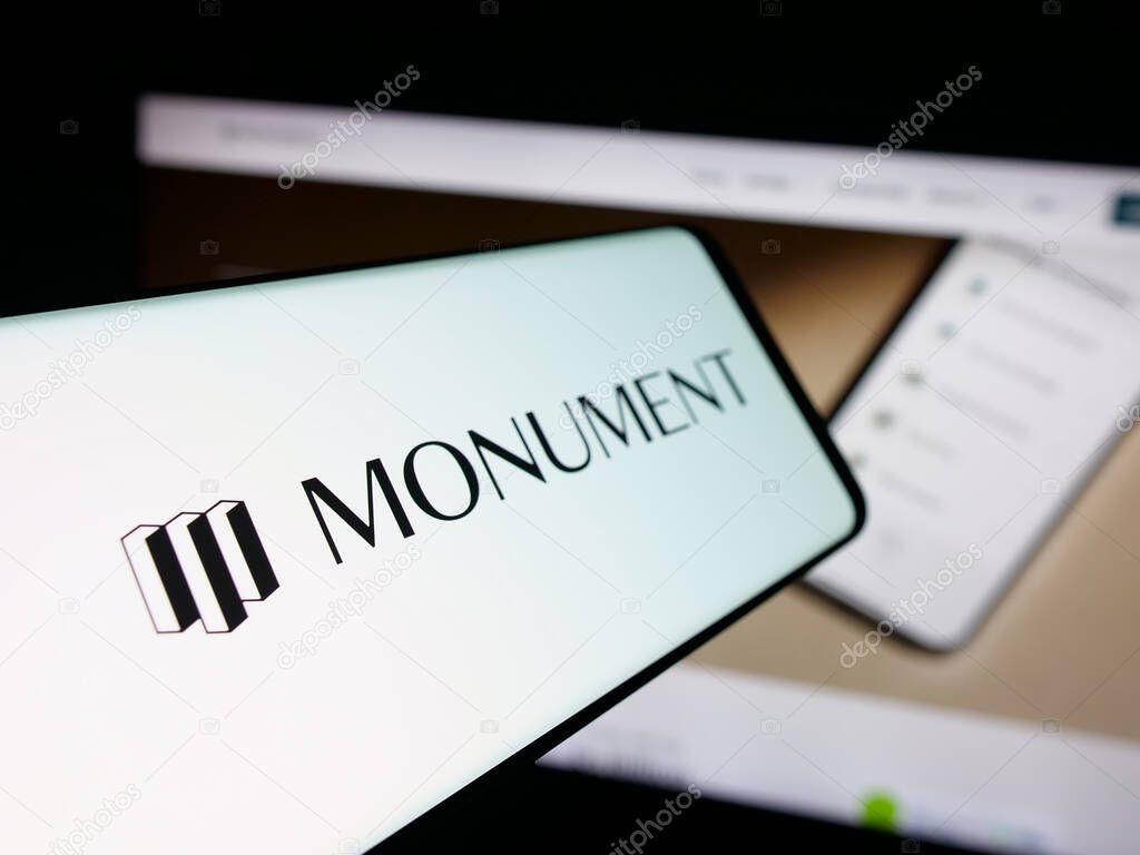 Stuttgart, Germany - 10-08-2025: Smartphone with logo of British banking company Monument Bank Limited on screen in front of website. Focus on left of phone display.