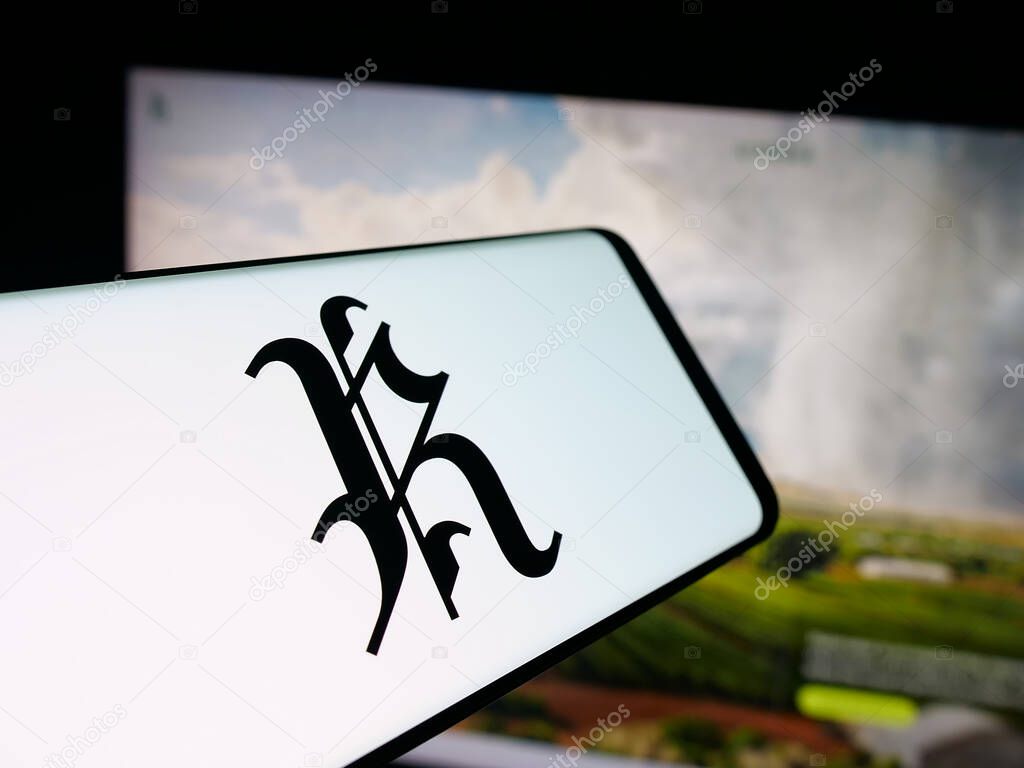 Stuttgart, Germany - 10-15-2025: Smartphone with logo of cloud seeding company Rainmaker Technology on screen in front of website. Focus on center of phone display.