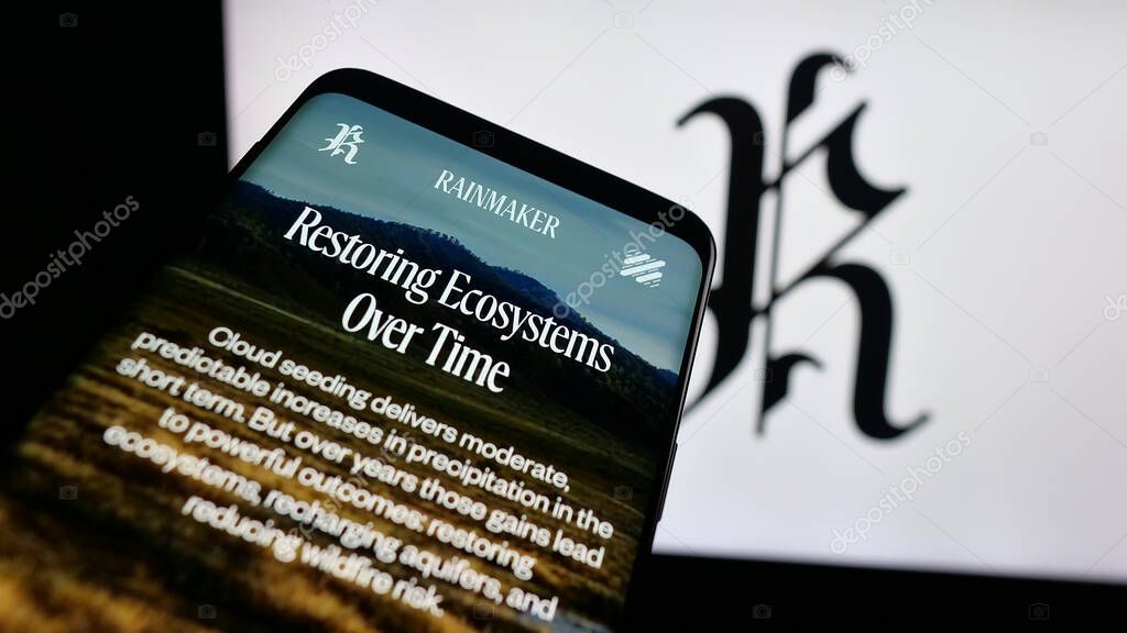 Stuttgart, Germany - 10-15-2025: Mobile phone with website of cloud seeding company Rainmaker Technology on screen in front of logo. Focus on top-left of phone display.