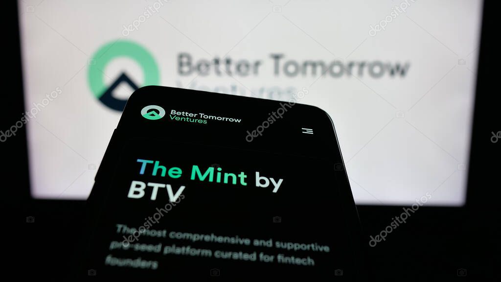 Stuttgart, Germany - 10-18-2025: Mobile phone with website of US company Better Tomorrow Ventures (BTV) on screen in front of logo. Focus on top-left of phone display.