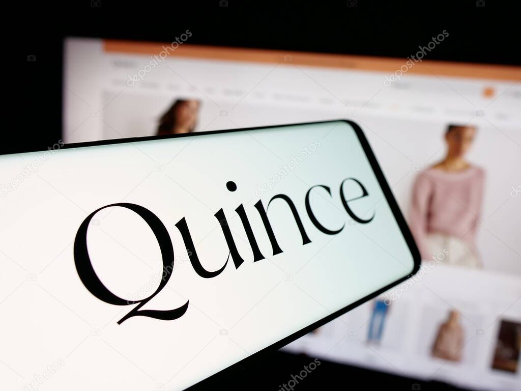 Stuttgart, Germany - 10-20-2025: Smartphone with logo of US fashion company Last Brand Inc. (Quince) on screen in front of website. Focus on center-left of phone display.