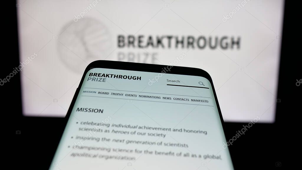 Stuttgart, Germany - 10-31-2025: Mobile phone with website of international awards Breakthrough Prizes on screen in front of logo. Focus on top-left of phone display.