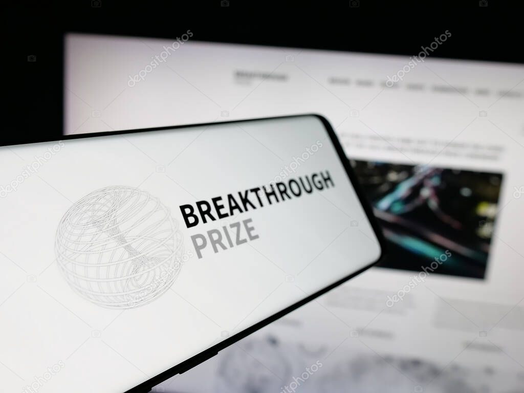 Stuttgart, Germany - 10-31-2025: Smartphone with logo of international awards Breakthrough Prizes on screen in front of website. Focus on center-left of phone display.