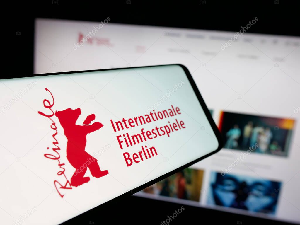 Stuttgart, Germany - 10-31-2025: Smartphone with logo of Berlin International Film Festival Berlinale on screen in front of website. Focus on center-left of phone display.
