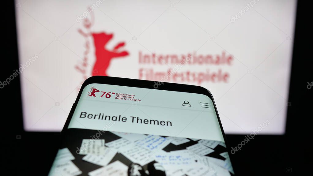 Stuttgart, Germany - 10-31-2025: Mobile phone with website of Berlin International Film Festival Berlinale on screen in front of logo. Focus on top-left of phone display.