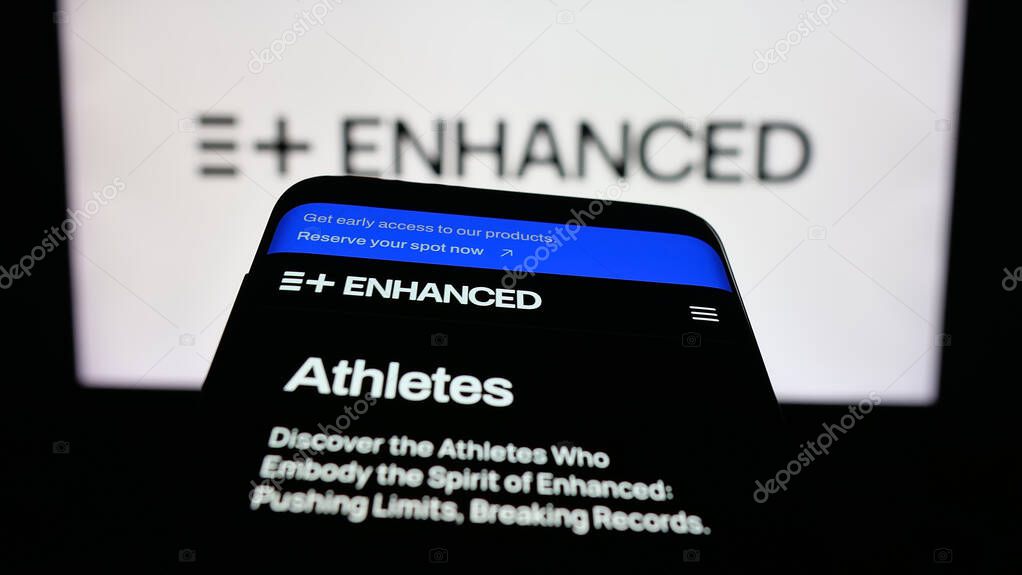 Stuttgart, Germany - 11-02-2025: Mobile phone with website of multi-sport event Enhanced Games on screen in front of logo. Focus on top-left of phone display.
