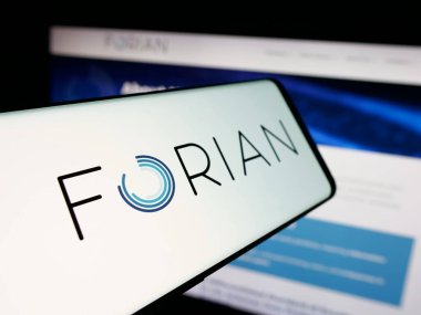 Stuttgart, Germany - 11-03-2025: Smartphone with logo of US software company Forian Inc. on screen in front of website. Focus on center-left of phone display.