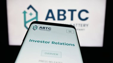 Stuttgart, Germany - 11-04-2025: Mobile phone with website of American Battery Technology Company (ABTC) on screen in front of logo. Focus on top-left of phone display.