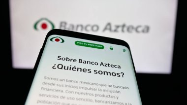 Stuttgart, Germany - 11-05-2025: Mobile phone with website of Mexican financial company Banco Azteca on screen in front of logo. Focus on top-left of phone display.