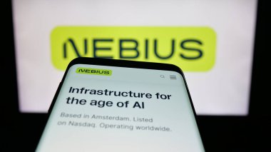 Stuttgart, Germany - 11-06-2025: Mobile phone with website of AI infrastructure company Nebius Group N.V. on screen in front of logo. Focus on top-left of phone display.