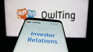 Stuttgart, Germany - 11-06-2025: Mobile phone with website of blockchain technology company OwlTing Group on screen in front of logo. Focus on top-left of phone display.