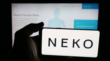 Stuttgart, Germany - 11-07-2025: Person holding mobile phone with logo of Swedish healthcare company Neko Health AB on screen in front of web page. Focus on phone display.