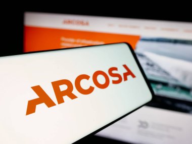 Stuttgart, Germany - 11-07-2025: Smartphone with logo of US infrastructure company Arcosa Inc. on screen in front of website. Focus on left of phone display.