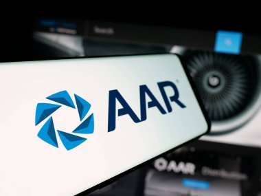Stuttgart, Germany - 11-08-2025: Smartphone with logo of US aircraft maintenance company AAR Corp. on screen in front of website. Focus on center-left of phone display.