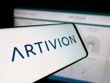 Stuttgart, Germany - 11-08-2025: Smartphone with logo of US tissue company Artivion Inc. on screen in front of website. Focus on center-left of phone display.