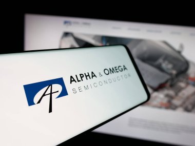 Stuttgart, Germany - 11-08-2025: Smartphone with logo of company Alpha and Omega Semiconductor Limited on screen in front of website. Focus on center-left of phone display.