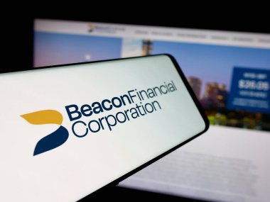 Stuttgart, Germany - 11-12-2025: Smartphone with logo of US banking company Beacon Financial Corp. on screen in front of website. Focus on center-left of phone display.