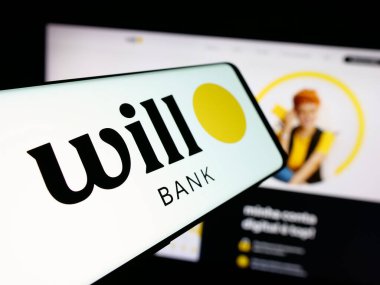 Stuttgart, Almanya - 11-28-2025: Brezilyalı banka logosu Will Financeira S.A. 'nın logosu web sitesinin önünde ekranda. Telefon ekranının merkezine odaklan.