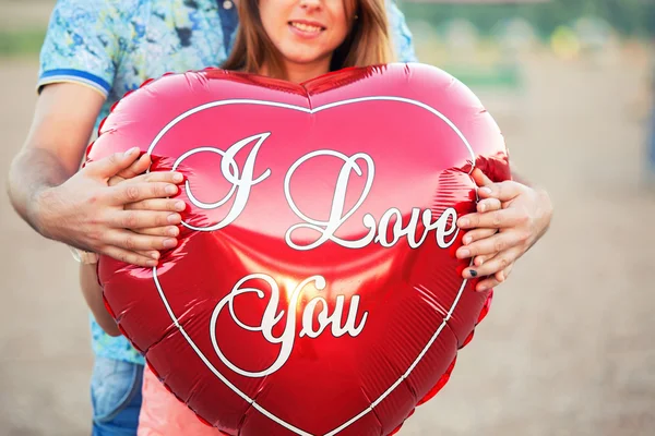 Red heart in the hands of lovers — Stock Photo, Image