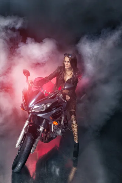 Girl on a motorcycle in smoke — Stock Photo, Image