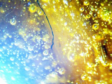 BHO 'nun fotoğrafı, ama kendinden yapılmış haşhaş yağı. Fotoğraf: mikroskop, serval efektli.