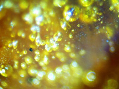 BHO 'nun fotoğrafı, ama kendinden yapılmış haşhaş yağı. Fotoğraf: mikroskop, serval efektli.