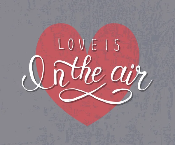 Hand sketched 'Love is in the air text'. Valentine's Day typograph — ストックベクタ