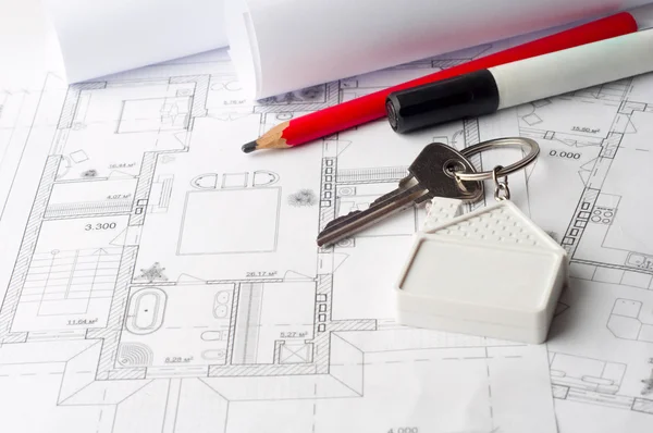 House keys on a house plan blueprint concept for new house desig — Stock Photo, Image
