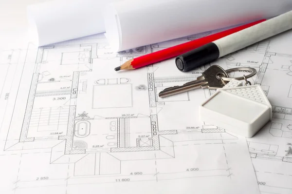 Claves de la casa en un concepto de plano de la casa para el nuevo diseño de la casa o la mejora del hogar Imágenes de stock libres de derechos