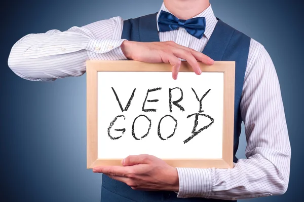 Ein Mann mit einem Schild in der Hand — Stockfoto