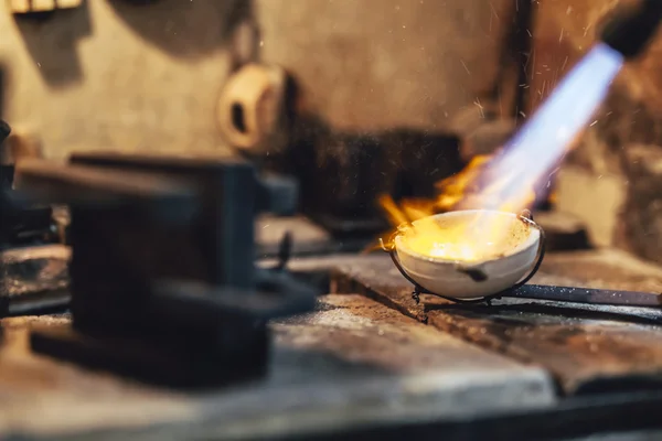 Goldsmith melting metal — Stock Photo, Image